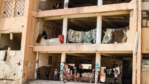 A view of a damaged building housing internally displaced Syrians from Deir Ezzor in Syria's ...