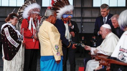 Pope Francis is welcomed after arriving at Edmonton International Airport, near Edmonton, Alberta, ...