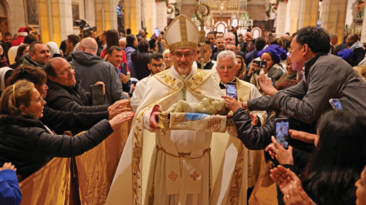 The acting Latin Patriarch of Jerusalem Pierbattista Pizzaballa leads a Christmas midnight mass at ...