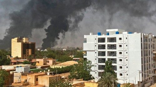 Smoke billows above residential buildings in Khartoum on April 16, 2023, as fighting in Sudan raged ...