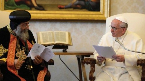 Pope Francis (R) listens to the Coptic Orthodox leader Tawadros II during a private audience in the ...