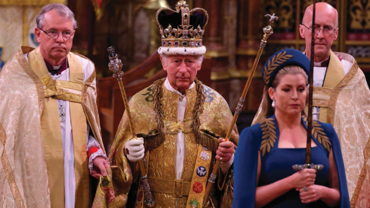 TOPSHOT - Britain's King Charles III walks wearing St Edward's Crown during the Coronation Ceremony ...