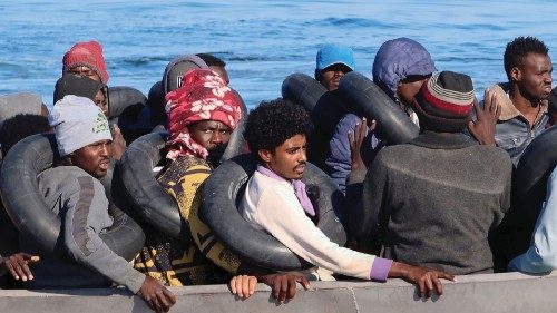 Migrants navigate on a metal boat as they are spotted by Tunisian coast guards at sea during their ...