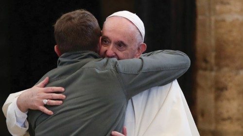 Pope Francis embraces a person as he meets with people who have made a pilgrimage to the Assisi, ...