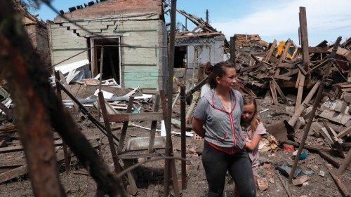 TOPSHOT - Residents survey the remains of their home in the aftermath of a Russian attack on ... TOPSHOT - Residents survey the remains of their home in the aftermath of a Russian attack on ...