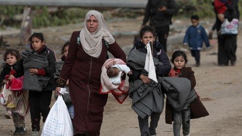 epa10999435 Palestinians walk after crossing from the northern Gaza Strip to the southern Gaza Strip ... epa10999435 Palestinians walk after crossing from the northern Gaza Strip to the southern Gaza Strip ...