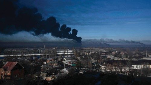 (FILES) Black smoke rises from a military airport in Chuguyev near Kharkiv on February 24, 2022. ... (FILES) Black smoke rises from a military airport in Chuguyev near Kharkiv on February 24, 2022. ...