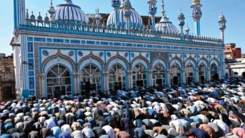 Muslim devotees offer first Friday prayers during the Islamic holy fasting month of Ramadan at a ... Muslim devotees offer first Friday prayers during the Islamic holy fasting month of Ramadan at a ...