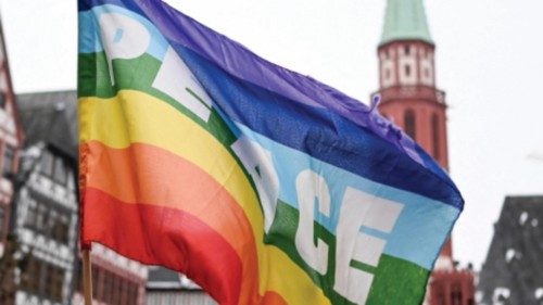 A rainbow colored flag with the inscription 'Peace' flutters in the wind during a demonstration ... A rainbow colored flag with the inscription 'Peace' flutters in the wind during a demonstration ...