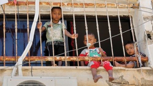 Children watch as mourners carry the bodies of three Palestinians who were killed in an Israeli ... Children watch as mourners carry the bodies of three Palestinians who were killed in an Israeli ...