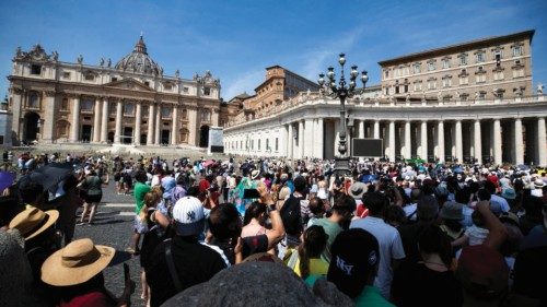 Faithful attend during Pope Francis' Angelus prayer on the Solemnity of the Assumption of the ...