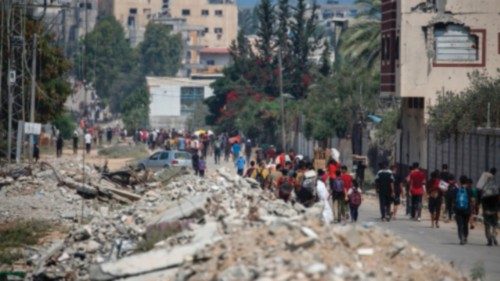 Displaced Palestinians at the Nuseirat refugee camp haul food parcels and other items they managed ... Displaced Palestinians at the Nuseirat refugee camp haul food parcels and other items they managed ...