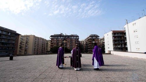 Priests celebrate the Sunday Holy Mass from the roof of the church San Gabriele dell'Addolorata in ...