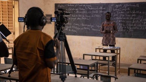 Wendlamita Marino Compaoré (R), a philosophy teacher, gives a philosophy class for final year high ...