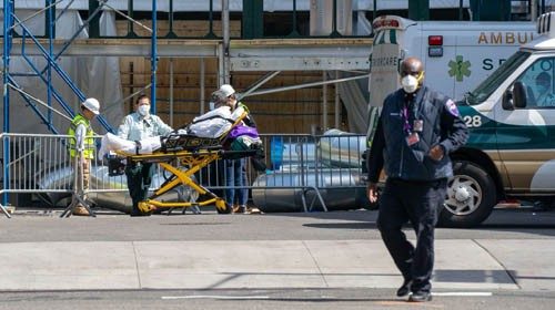 NEW YORK, NY - APRIL 7: A person is escorted into the emergency room at NYU Langone Hospital on ...