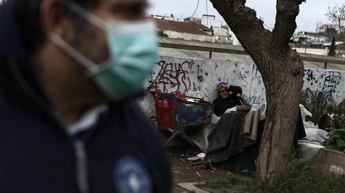 epa08350033 A member of the Doctors of the World talks with a homeless woman during a distribution ... epa08350033 A member of the Doctors of the World talks with a homeless woman during a distribution ...