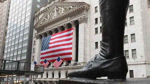 (FILES) In this file photo a view of the New York Stock Exchange is seenon Wall Street on March 23, ...