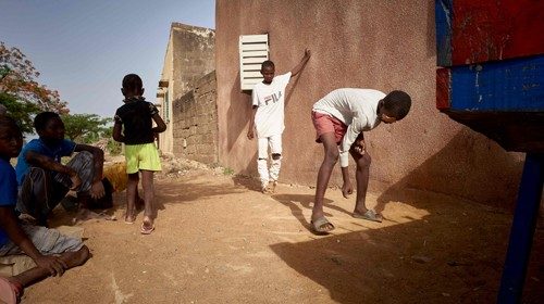 Malian children play marbles in the district of Djicoroni Para, in Bamako on May 1, 2020. Due to the ...