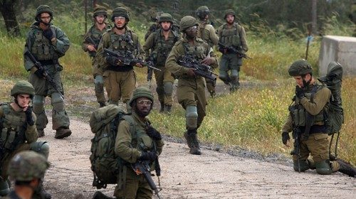 Israeli soldiers take part in an exercise near the border with Syria in the Israel-annexed Golan ...