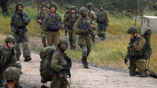 Israeli soldiers take part in an exercise near the border with Syria in the Israel-annexed Golan ... Israeli soldiers take part in an exercise near the border with Syria in the Israel-annexed Golan ...