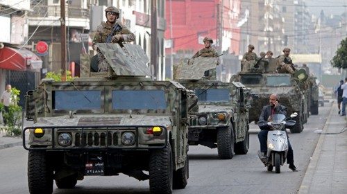 Lebanese army reinforcements arrive in the northern port city of Tripoli on April 28, 2020, during ...