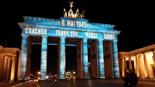 The Brandenburg Gate is illuminated with the words 'Thank you' in Russian, English, French and ...