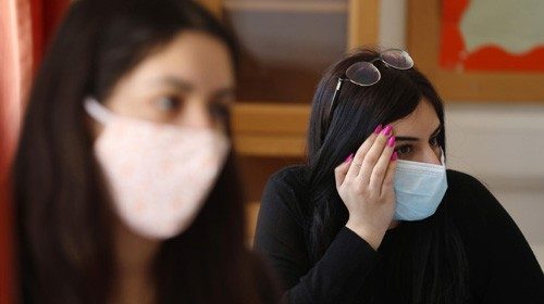 epa08414809 High school seniors attend a class amid easing coronavirus restrictive measures on ...