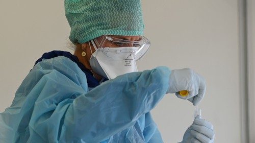 Biologists of the Synlab laboratory work at a COVID-19 coronavirus testing centre after collecting ...