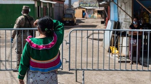 epa08422095 An indigenous woman covers herself from the sun in Cantagallo, central Lima, Peru, 13 ...