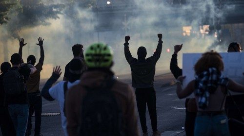 MINNEAPOLIS, MN - MAY 29: Protesters face off with police near the Third Police Precinct on May 29, ...