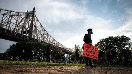 Protesters hold placards as they take part in a 'Black Lives Matter' vigil on June 3, 2020 in the ...