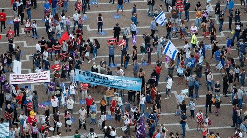 Protesters gather in Tel Aviv's Rabin Square on June 6, 2020, to denounce Israel's plan to annex ...