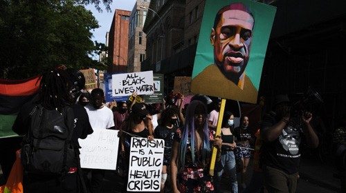 epaselect epa08487417 People march during a Black Lives Matter protest against police brutality as ...