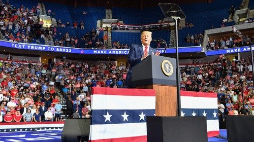 TOPSHOT - The upper section is seen partially empty as US President Donald Trump speaks during a ...