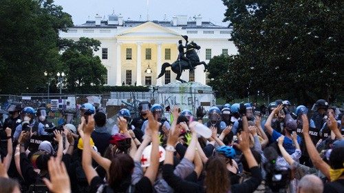 epaselect epa08503104 Protesters put their hands in the air as police clear out Lafayette Park ... epaselect epa08503104 Protesters put their hands in the air as police clear out Lafayette Park ...