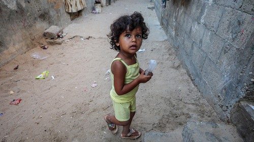 epa08516779 A Palestinian girl play next to her family house, in Khan Younis refugee camp in the ... epa08516779 A Palestinian girl play next to her family house, in Khan Younis refugee camp in the ...