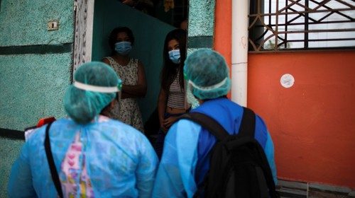 Municipality healthcare workers talk with residents during a house-to-house medical campaign as they ...