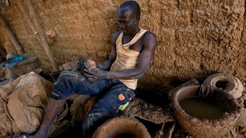 David Plantino, 35, a pottery maker from South Sudan, listens to the radio as he rests at the ...