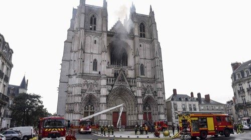 Firefighters are at work to put out a fire at the Saint-Pierre-et-Saint-Paul cathedral in Nantes, ...