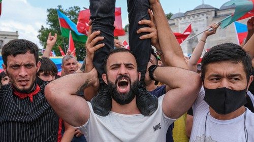epa08554737 Ultra-nationalist Azerbaijani and Turkish people hold their national flags as they ...