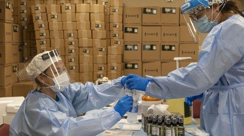 HOUSTON, TX - JULY 17: Medical workers from New York wearing personal protective equipments handle ... HOUSTON, TX - JULY 17: Medical workers from New York wearing personal protective equipments handle ...