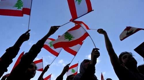 epa08552504 Anti-government protesters wave national flags during a protest called by member of ...