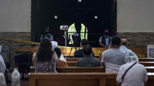 epa08581060 Several people participate in a day of prayer after the fire that burned a historic ...