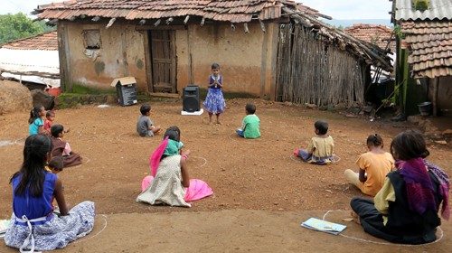 Children, who have missed their online classes due to a lack of internet facilities, sit on the ...