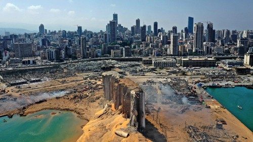 An aerial view shows the massive damage done to Beirut port's grain silos (C) and the area around it ... An aerial view shows the massive damage done to Beirut port's grain silos (C) and the area around it ...