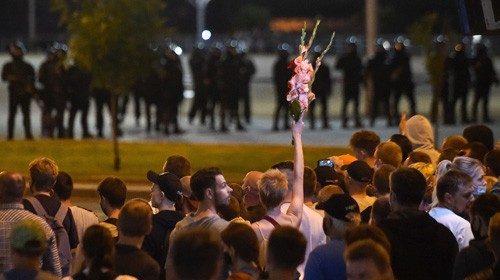 TOPSHOT - Opposition supporters rally the day after the presidential election in Minsk on August 10, ...