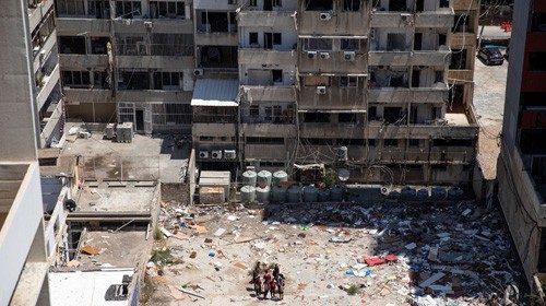 Volunteers prepare to clear the area around Lebanon's Electricity Company (EDL) headquarters, in the ...