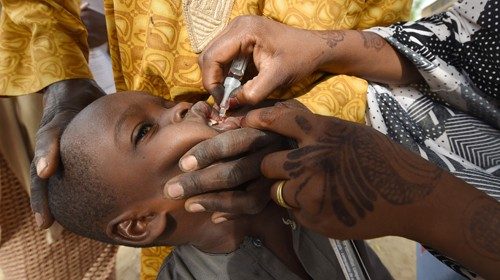 (FILES) In this file photo taken on April 22, 2017 A Health worker administers a vaccine to a child ... (FILES) In this file photo taken on April 22, 2017 A Health worker administers a vaccine to a child ...