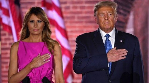 TOPSHOT - US First Lady Melania Trump and US President Donald Trump listen to the US National ... TOPSHOT - US First Lady Melania Trump and US President Donald Trump listen to the US National ...