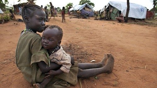 YIDA REFUGEE CAMP, SOUTH SUDAN - JULY 4: New arrivals crowd together living in makeshift shelter at ...